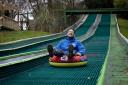 'It’s a tough job but somebody’s got to do it!' Rides and activities manager Peter Froment road tests the slide