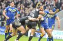 Gene Ormsby is hooked by Hull FC hooker Danny Houghton in Sunday’s Super League encounter at The Halliwell Jones Stadium