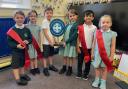 St Asaph V P Infant School pupils hold their prize.