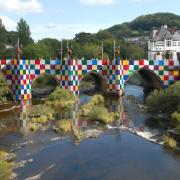 Patchwork panels of ‘Bridges, Not Walls’ Llangollen Bridge artwork by artist Luke Jerram.