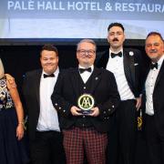 The team from Palé Hall receives its award at the AA Hospitality Awards 2023.