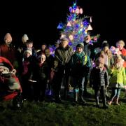 Residents in Glasfryn, Denbighshire, turned on a Christmas tree decorated with 30-mph signs last night and claimed traffic passing through the village is already slowing in response..