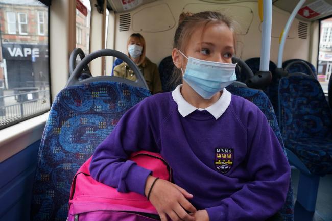 File photo dated 15/6/2020 of a school pupil wearing a face mask. Photo credit: Owen Humphreys/PA Wire.