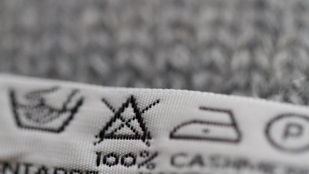 Denbighshire Free Press: Always check the tag before you wash. It will tell you what fibre the garment is made from and show you symbols that explain how to care for it. Credit: Getty Images