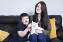 Connor Raven, pictured with mum Siobhan and award winning cat Minty.