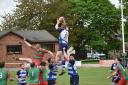 Arwyn Davies being lifted by Steff Simm and Ilan Evans