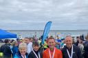 Denbigh Harriers with their medals at the Holyhead Breakwater five-mile race