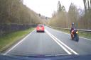 The motorcyclist overtakes the unmarked police car