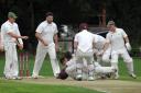 Just not cricket: St Asaph and Northop get to grips on the final game of the season. Picture: Phil Micheu