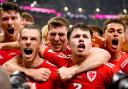 Wales' Gareth Bale (second left) celebrates with his team-mates after scoring their side's first goal of the game from the penalty spot during the FIFA World Cup Group B match at the Ahmad Bin Ali Stadium, Al-Rayyan. Picture date: Monday November 21,