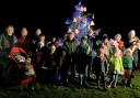 Residents in Glasfryn, Denbighshire, turned on a Christmas tree decorated with 30-mph signs last night and claimed traffic passing through the village is already slowing in response..