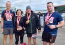 Denbigh Harriers Peter, Alison, Chris and Brychan with their Manchester Marathon medals.