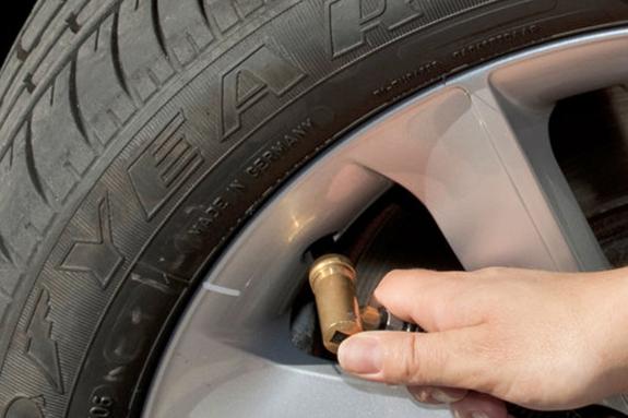 Denbighshire Free Press: Checking the tread of a car tyre is crucial (PA Features Archive/Press Association Images) Denbighshire Free Press: Checking the tread of a car tyre is crucial (PA Features Archive/Press Association Images)