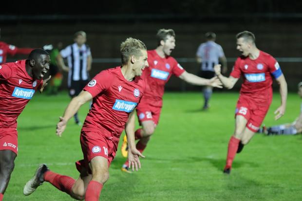 Dave Edwards wheels off to celebrate his late winner v Flint Town United. PIC: Bala Town FC.