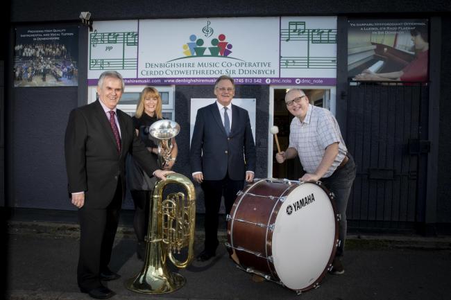 Mark Isherwood visit to North Wales Music Co-operative.   Pictured Mark Isherwood with Cooperative chair Cllr Mark Young , Mike Williams Business advisor for social business Wales and Heather Powell ; Music Co-operative founder and head of service .