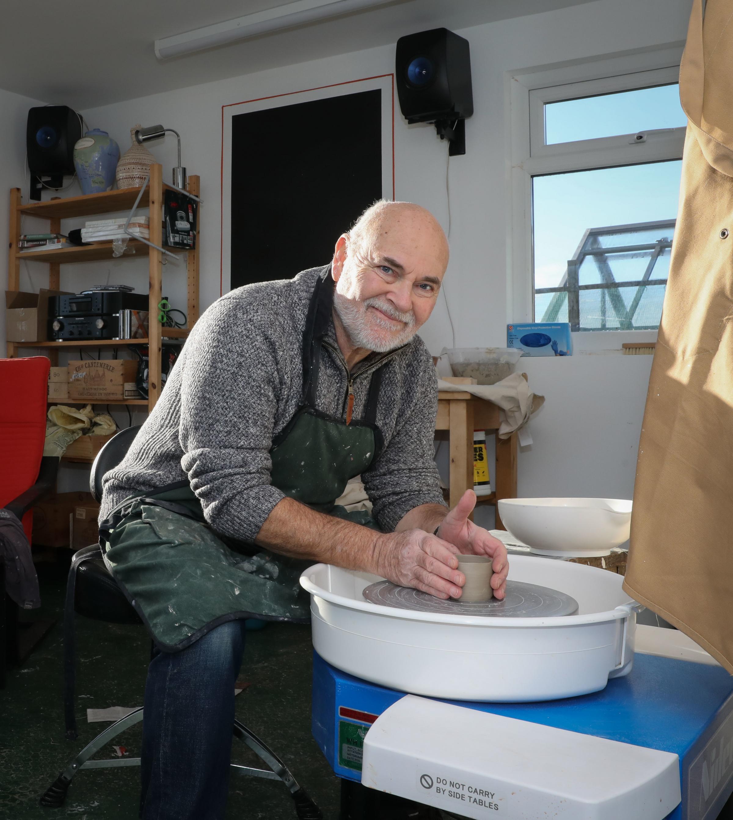 Hafod Renewables Burwen, Anglesey Martin Schwaller at work in his garden ceramic studio.The power for the studio and kiln benefit from green energy