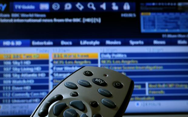 Denbighshire Free Press: Sky TV remote and TV guide (PA)