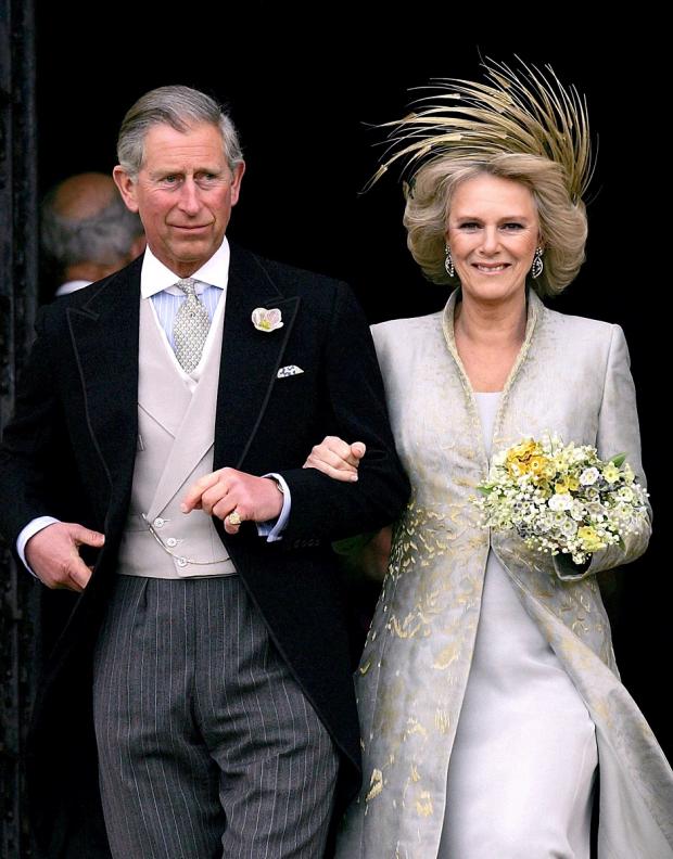 Denbighshire Free Press: Charles and Camilla were married in a civil ceremony at Windsor Guildhall in 2005. Picture: PA