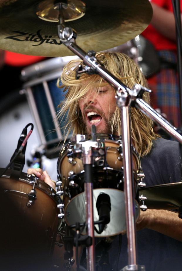 Denbighshire Free Press: Taylor Hawkins performs during the Live Earth charity concert at Wembley Stadium, London (PA)
