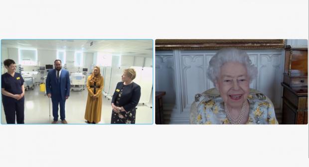 Denbighshire Free Press: Queen Elizabeth II speaking to Dr Marie Healey, Divisional Director for Surgery and Critical Care; Mr Asef and Mrs Shamina Hussain; and Jackie Sullivan during a video link call (PA)