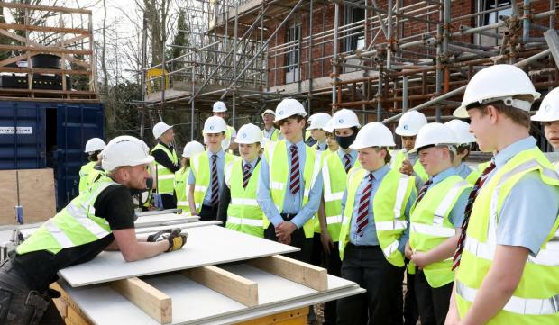 Denbighshire Free Press: Year Nine students from Denbigh High School at Brenig Construction’s Llwyn Eirin development in Denbigh. Picture: Rick Matthews