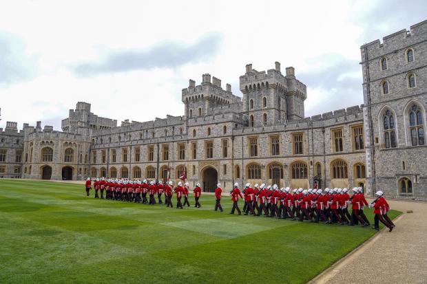 Denbighshire Free Press: The Earl of Wessex presents new colours to the Royal Gibraltar Regiment during a ceremony at Windsor Castle. Picture: PA