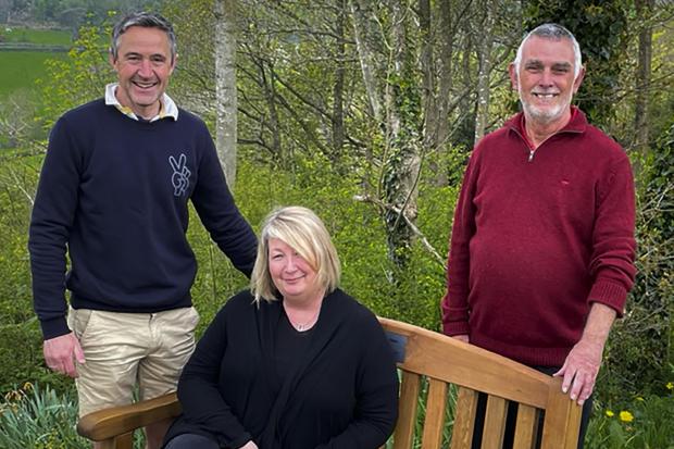 Sharon Jones at the memorial to her brother, Kevin Glyn Jones, on the seventh tee at Ruthin Pwllglas Golf Club with Rhys Hughes, left, of the P&A Group and club chairman Ian Vaughan Evans.