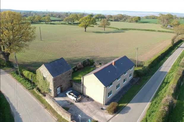 Tai Cochion, on Starkey Lane, in Northop has a guide price of £450,000.