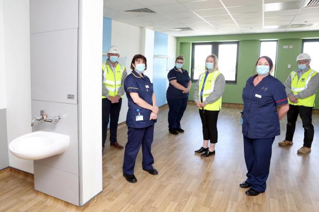 Denbighshire Free Press: L-R: Graham Dickson, Wynne Construction Contracts Manager; Jane Owen, Acting Head of Nursing; Bethan Rogers, Ward Manager; Ruth Stiles, BCUHB Planning; Claire Bowen, Matron; Paul Roberts, Wynne Construction Site Manager, during a brief tour of the newly refurbished Ward 10 at Ysbyty Glan Clwyd, Bodelwyddan