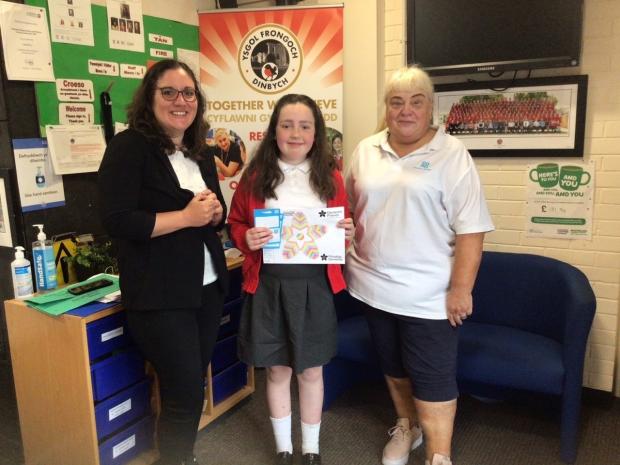 Denbighshire Free Press: Nella, from year six, entered and won a colouring competition which was organised by Denbigh Co-op as part of Dementia Friendly Denbigh.