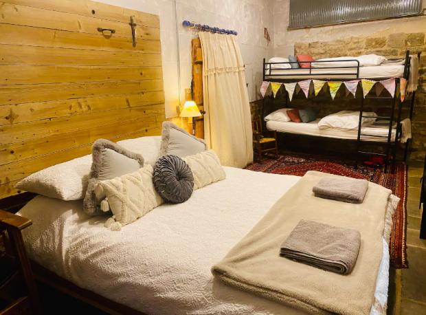 Denbighshire Free Press: A look inside the bedroom at Basil's Place (Brittany Sparham // Instagram @onhorseback/Airbnb)