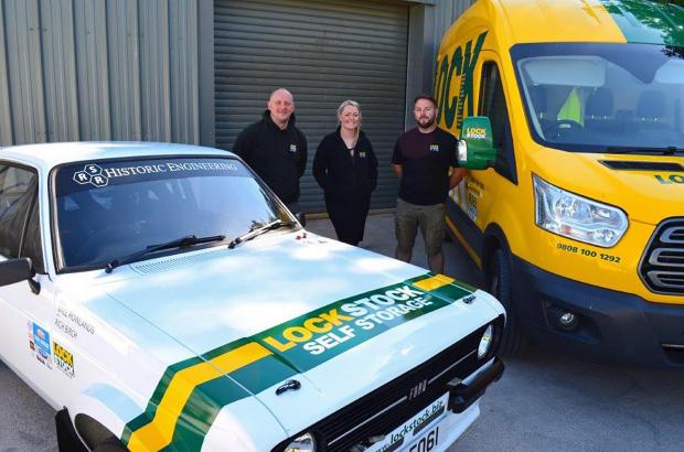 Denbighshire Free Press: Will Rowlands, left, Rich Birch and their classic Ford Escort rally car with Lisa James, of sponsors Lock Stock Self Storage