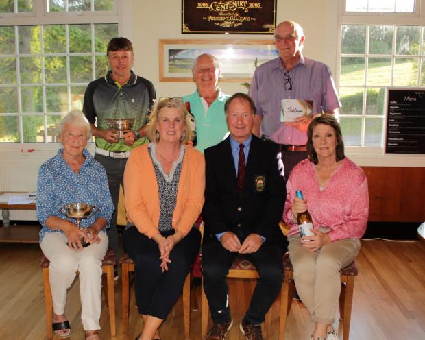 Denbighshire Free Press: Ruthin Pwllglas captain’s day winners. From left, back, winner Mike Halsall; Graham Lowe, Division Two winner; Peter Hodson, Division Two runner-up. Front, ladies winner Delyth Lewis; Club captain Andrew Spink and his wife, Tanya, and ladies runner-up Sue Roberts. Picture: Gordon Roberts.