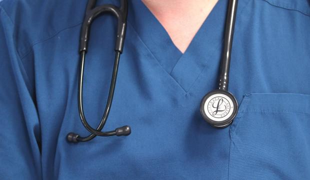 Denbighshire Free Press: A doctor wearing a stethoscope. Credit: PA