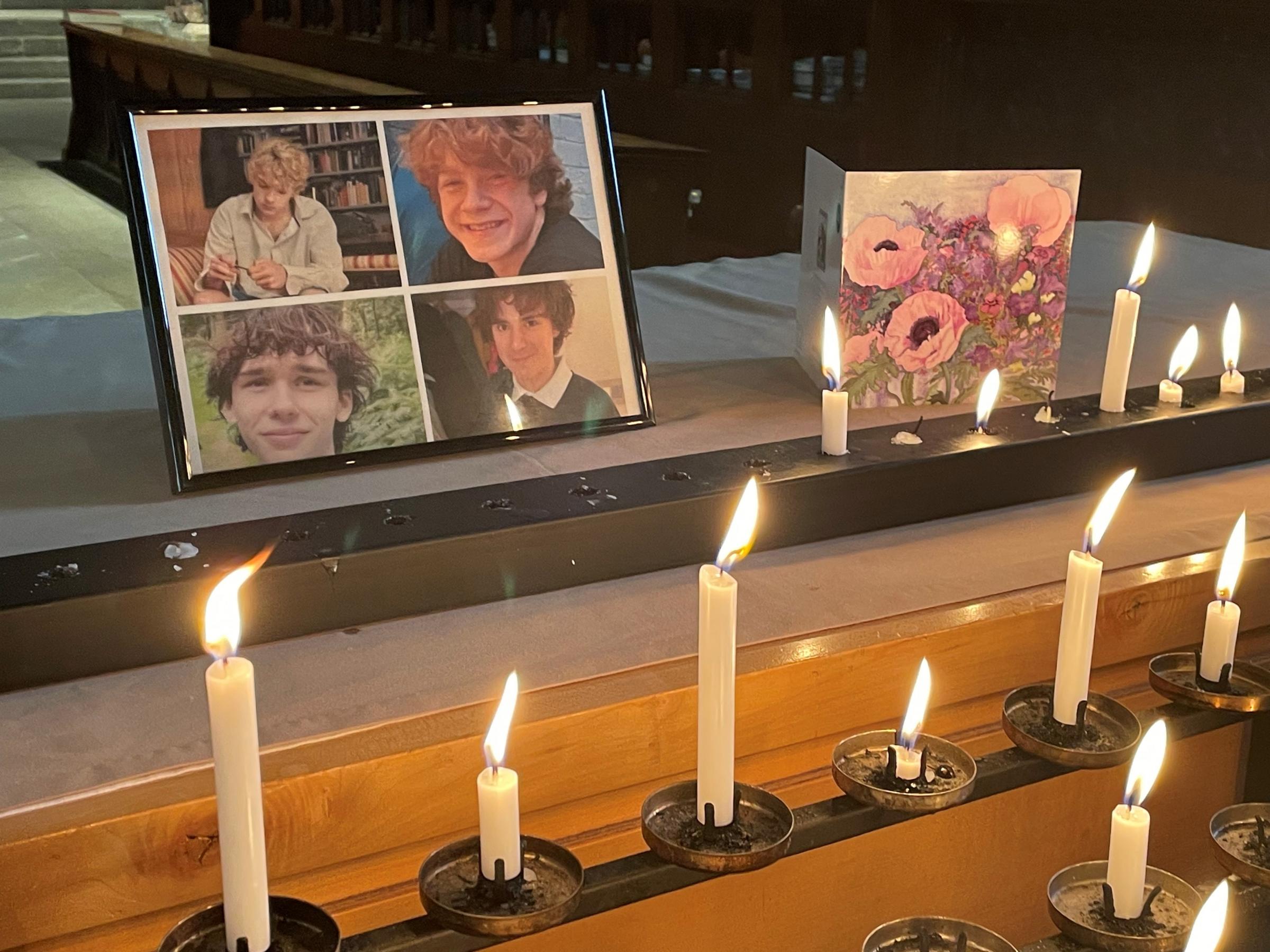 candles and a sympathy card inside Shrewsbury Abbey. Image: PA
