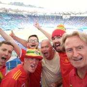 Family handout photo dated 20/06/21 of Tim Hartley (right) and Nick Williams (second right) at the Wales vs Italy game in Rome. Wales fans who have made it to Amsterdam for their country's crucial last 16 Euro 2020 match against Denmark have said it