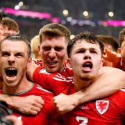 Wales' Gareth Bale (second left) celebrates with his team-mates after scoring their side's first goal of the game from the penalty spot during the FIFA World Cup Group B match at the Ahmad Bin Ali Stadium, Al-Rayyan. Picture date: Monday November 21,