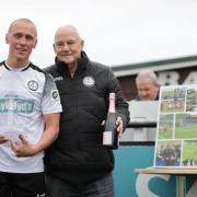Bala Town general manager Nigel Aykroyd congratulates Kieran Smith on his 262nd appearance for the club. Picture: Bala Town FC