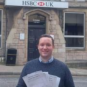 Gareth Davies MS with petitions outside Denbigh's HSBC branch