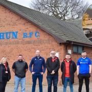 Representatives from the Welsh Rugby Union, CVSC’s Clocaenog Forest Wind Farm, GJ Teeson Ltd and Ruthin Rugby Club and, inset, a concept visualisation of the proposed Ruthin Rugby Club development.