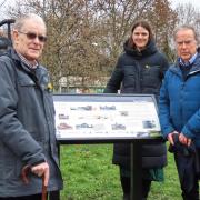 Vernon Hughes and Arnold Hughes, sons of the last stationmaster at Ruthin Railway Station, alongside Helen Morgan representing Jones Bros, who part-funded the project.