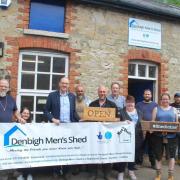 Llyr Gruffydd MS during a visit to Denbigh Men's Shed last summer