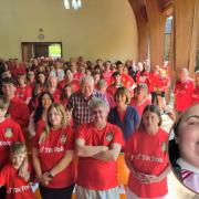 Main image: A sea of red for Maria Edwards' funeral / Inset: Maria Edwards