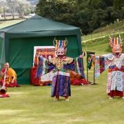 Buddhist monks from the Tashilhunpo Monastery performing their sacred dance tradition (cham) in the gardens at Eyarth House.