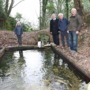 Pictured in 2019 at St Dyfnog's Well: Sam Jones, project manager, Elfed williams, chair, ad David Wilson and Adrian Evans.