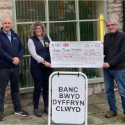 NFU Mutual donation to Denbigh foobanks:  Mark Owen, chairperson, Carys Jones, of  Ruthin agency,  and Gwyn Parry, treasurer.
