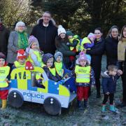North Wales Police and Crime Commissioner Andy Dunbobbin met members of Efenechtyd Community Council, including Chair Wynn Jones, and children from the Miri Meithrin nursery.