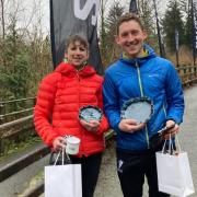 Emma Collins and Tony Wood with their trophys, Winter Trail Gaeaf 2024