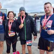 Denbigh Harriers Peter, Alison, Chris and Brychan with their Manchester Marathon medals.