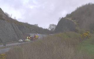 The road closed in both directions while emergency crews attended the scene